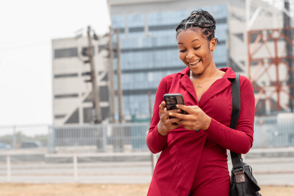 happy woman texting her fall attorney to thank them
