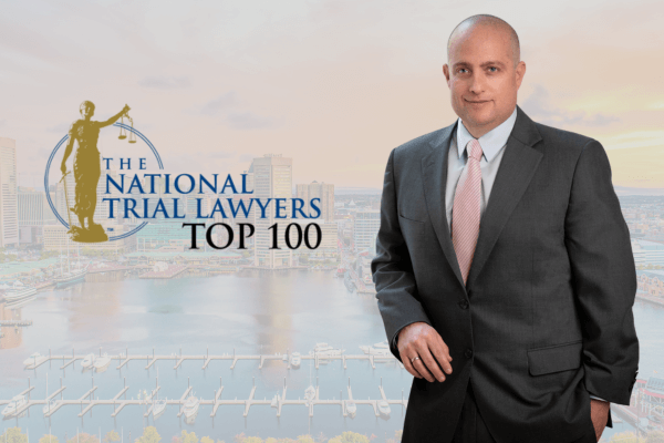 Experienced personal injury attorney, Neil Dubovsky, with Top 100 National Trial Lawyers badge