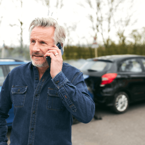 man calling personal injury lawyer after accident in Maryland